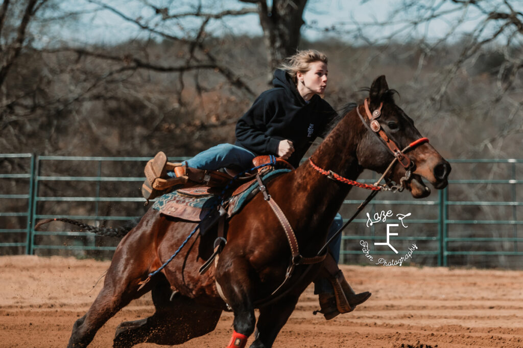blonde rider on dark bay horse
