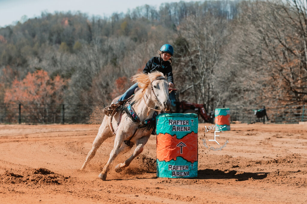little barrel racer on gray horse