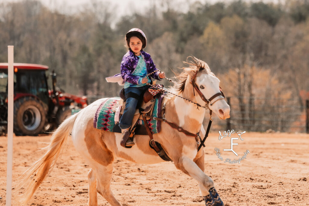 little rider on paint horse