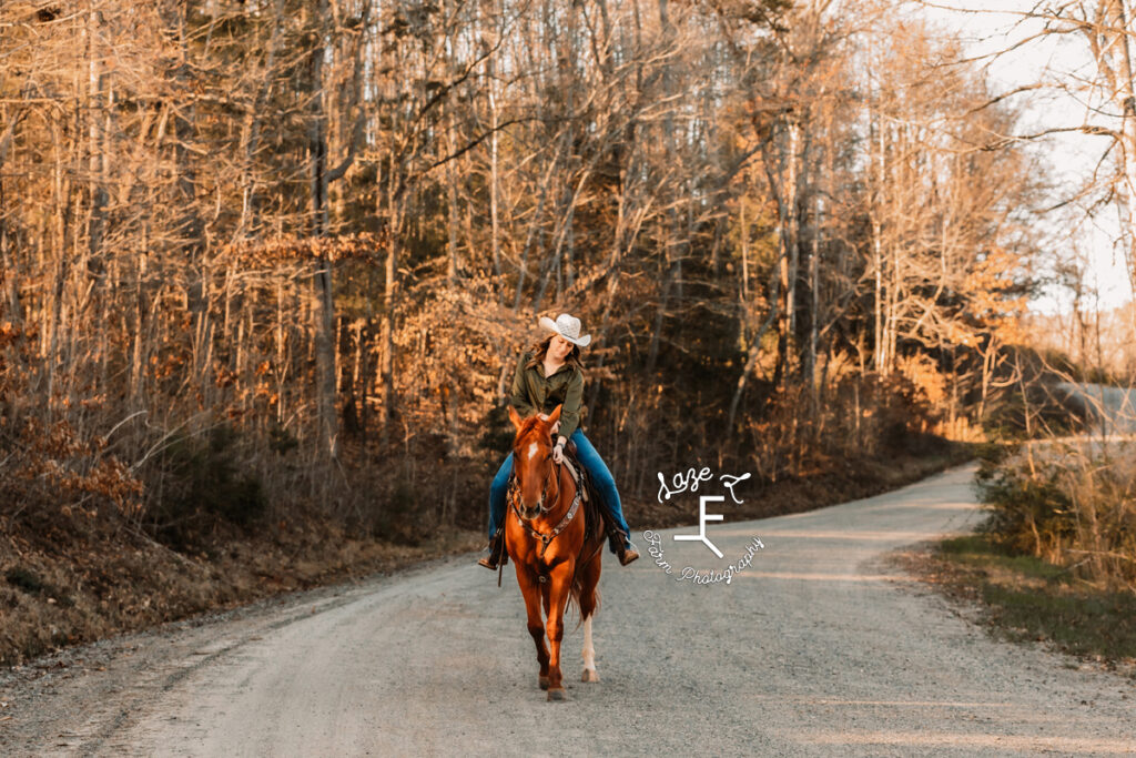 Gina and Chip riding down dirt road