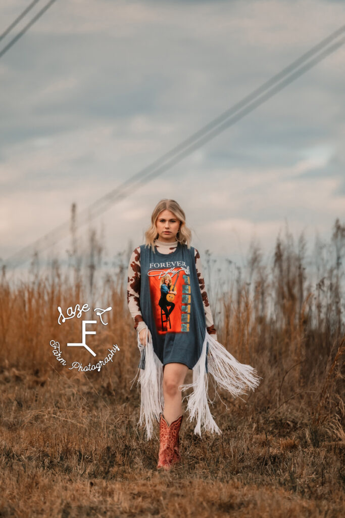 Reid in blue fringe dress and brown boots