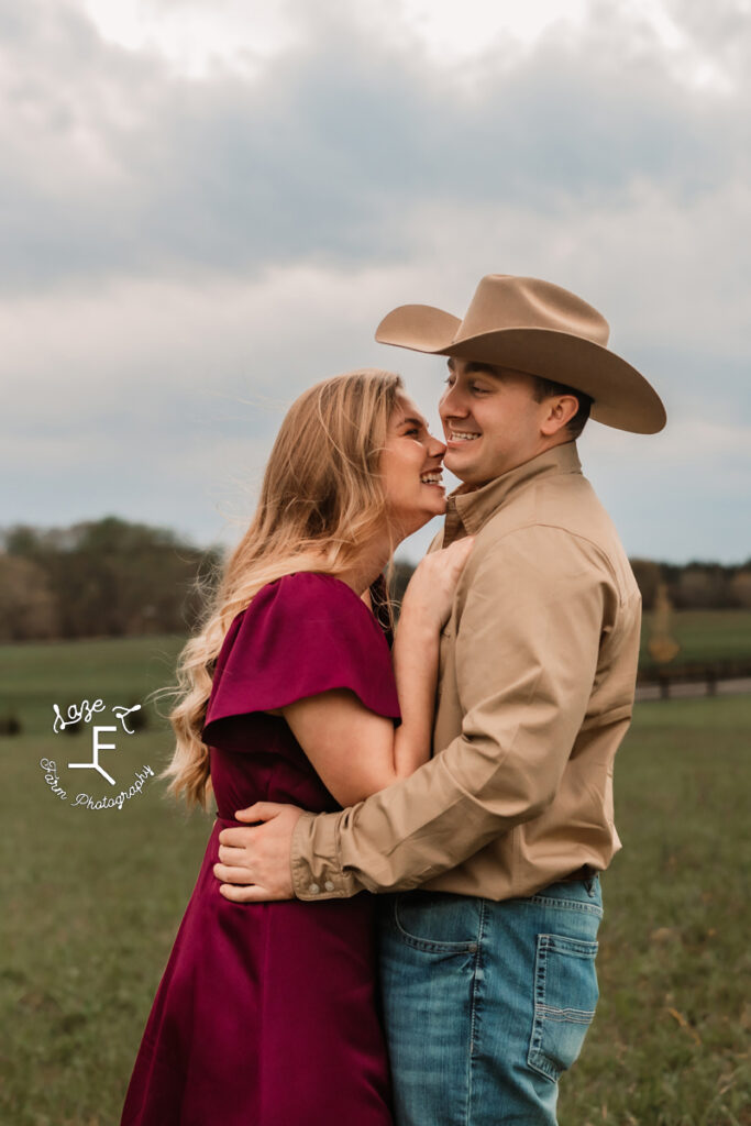 Morgan and Tanner facing each other laughing