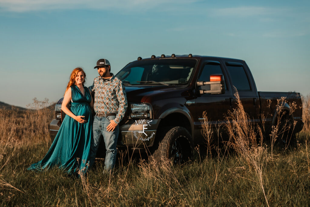 Alex and Codi standing in front of his truck