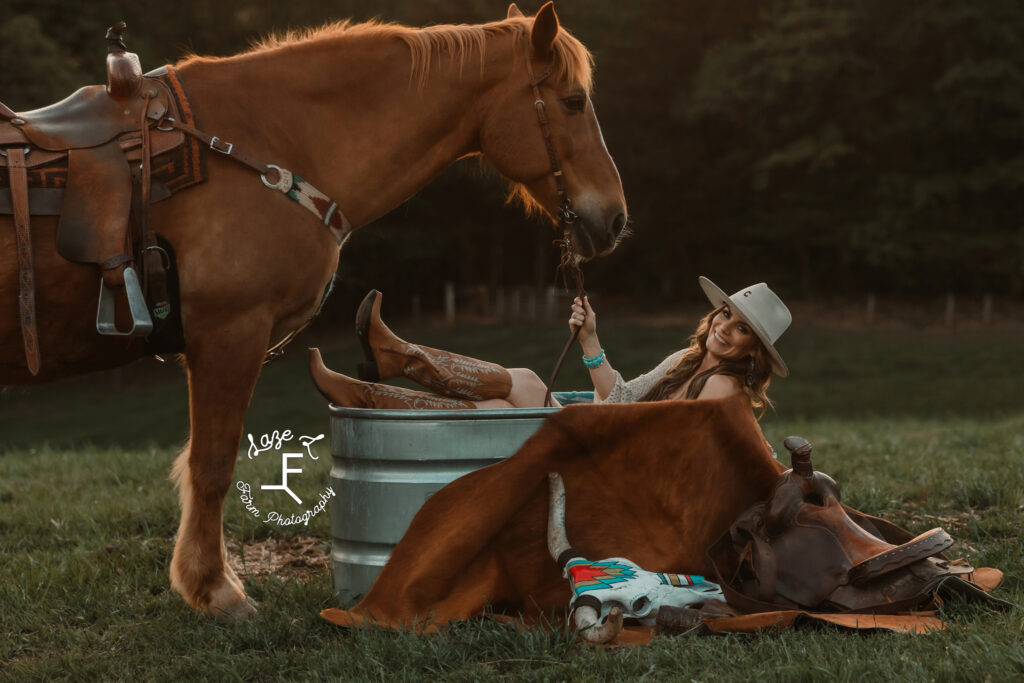 Wendy in the water trough with Gus standing in front of her