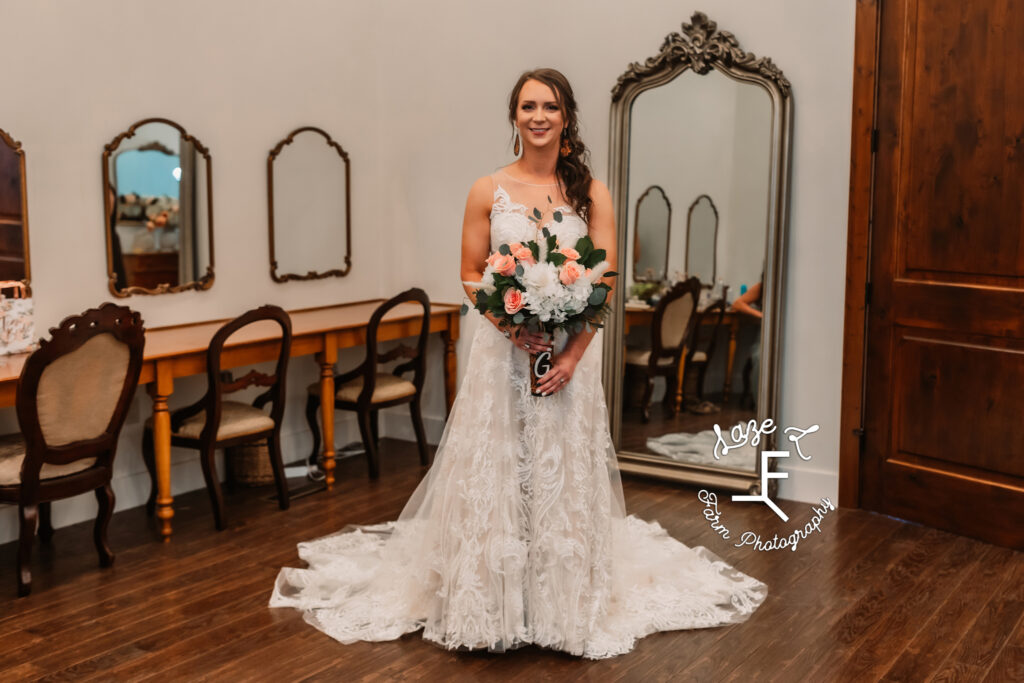 bride standing with bouquet