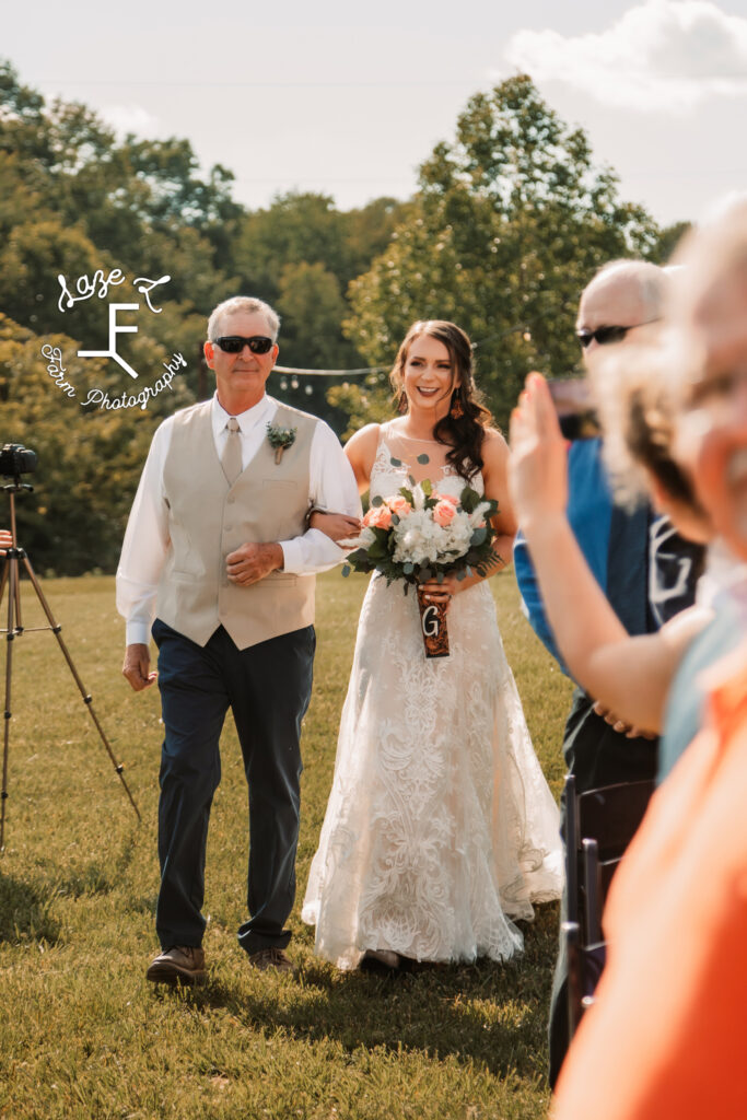 bride walking with her dad down the aisle