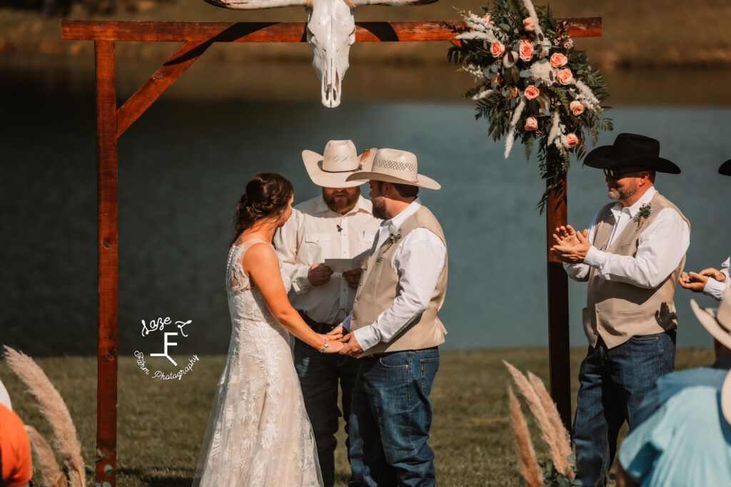 bride and groom at the alter