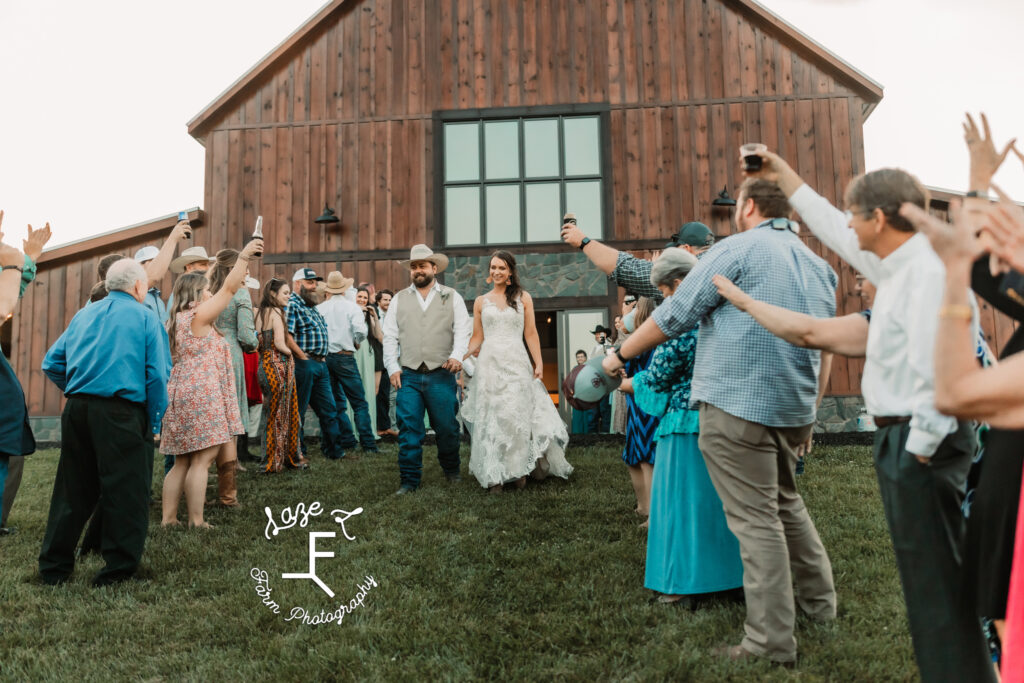 bride and groom leaving venue