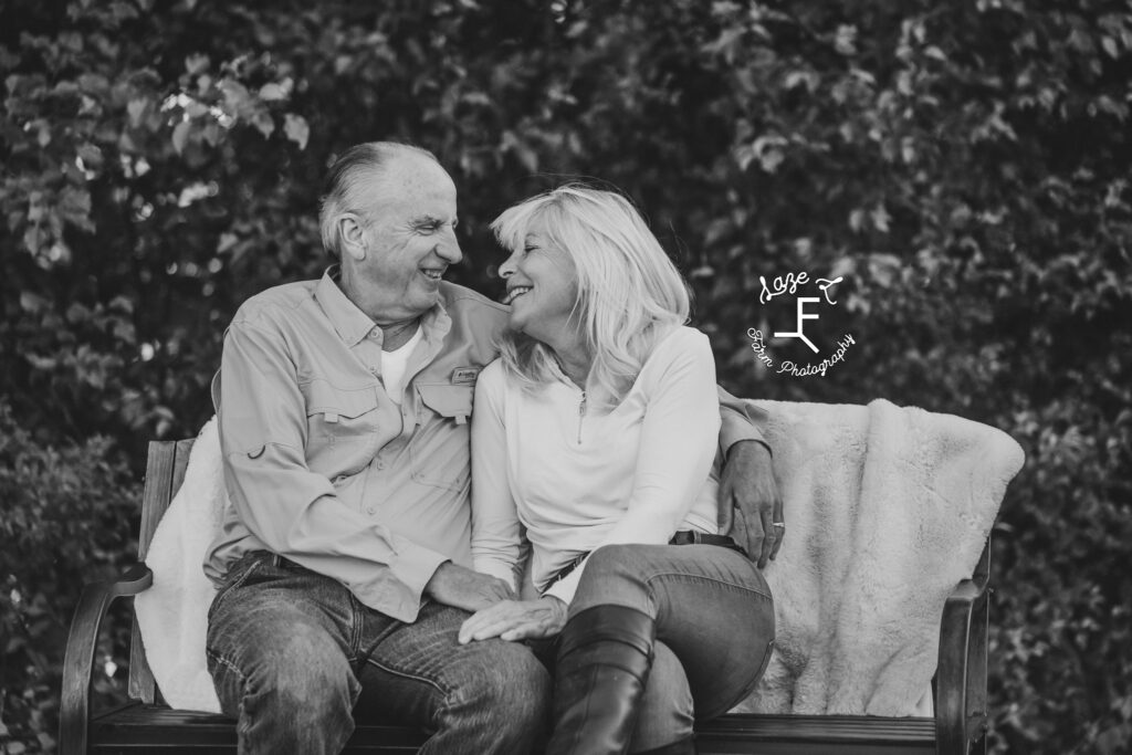 Sally and husband looking at each other in black and white