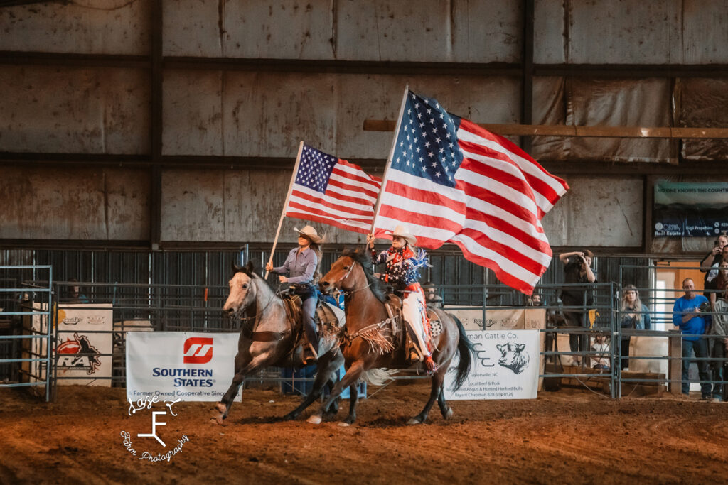 Opening ceremonies with 2 American flags 