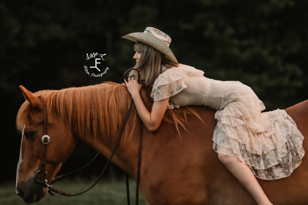 cowgirl on a horse at sunset