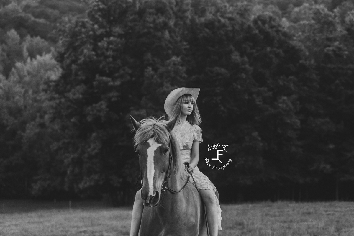 cowgirl riding on a horse