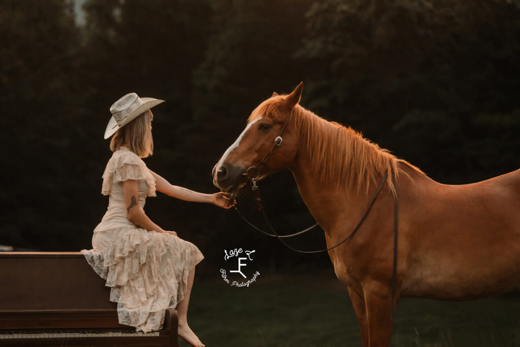 cowgirl petting her horse