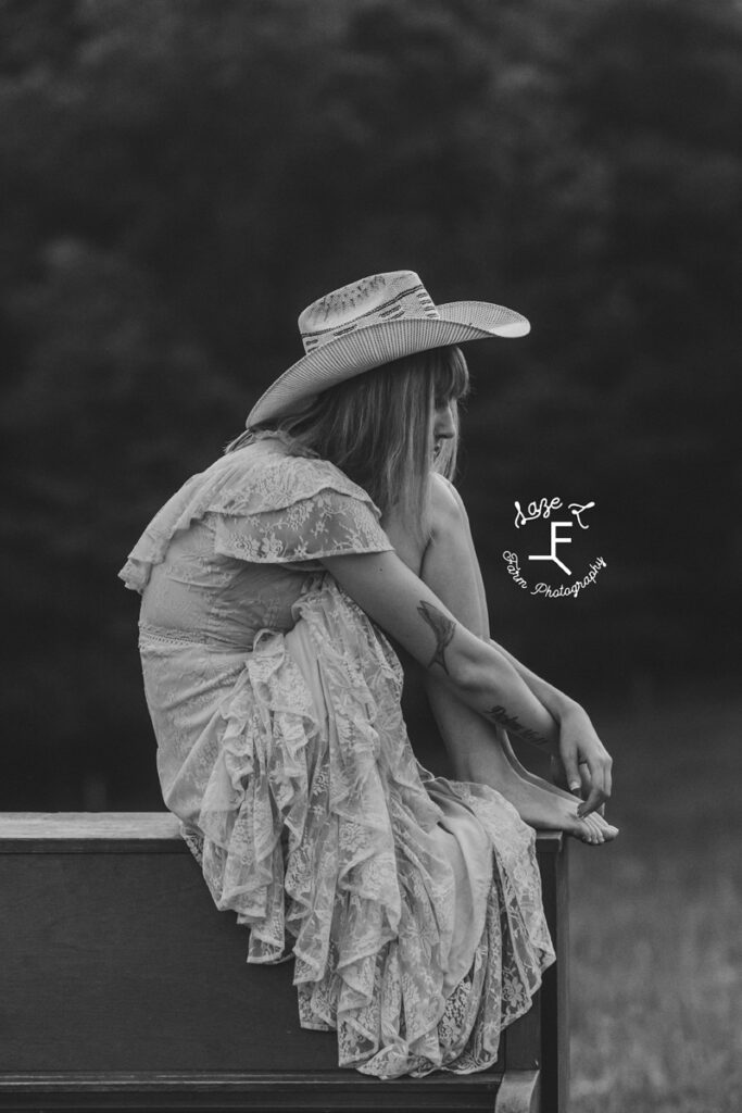 cowgirl sitting on a piano