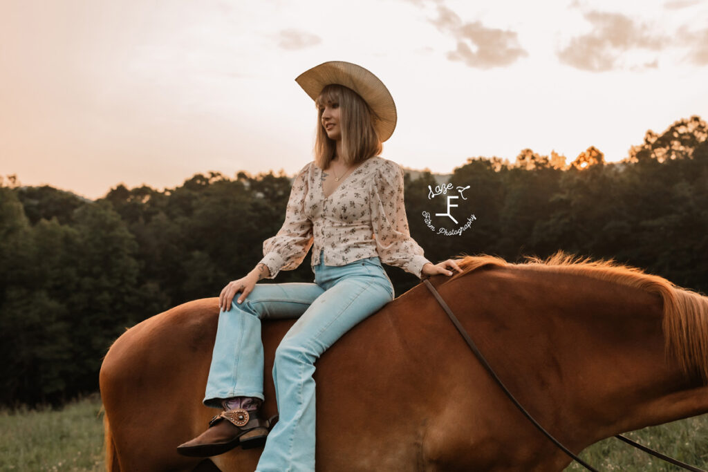 cowgirl on a horse at sunset