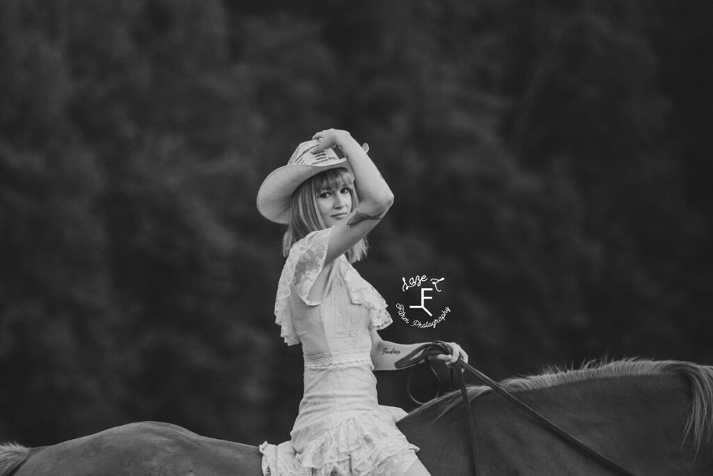 cowgirl on a horse at sunset