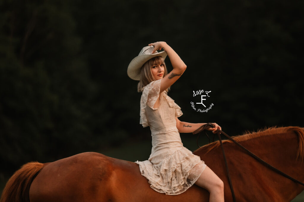 cowgirl on a horse at sunset