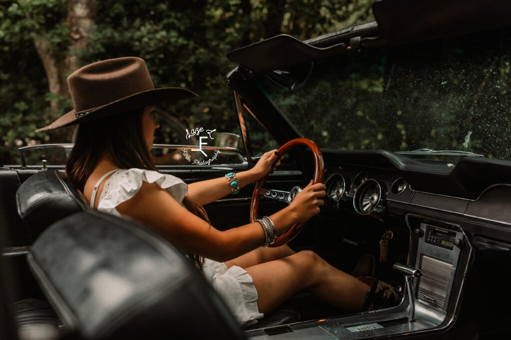 girl driving classic car