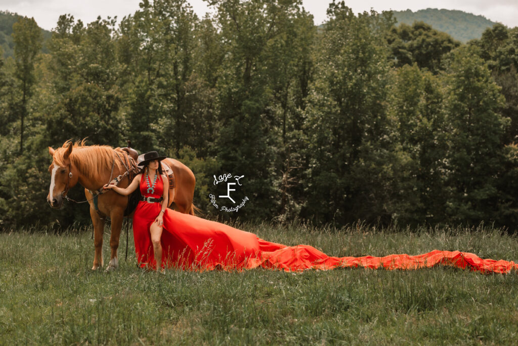 cowgirl with red parachute dress on a horse