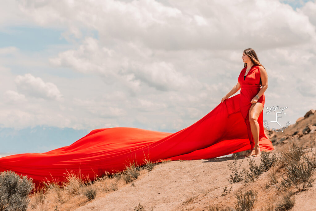 Savannah with red dress train flowing