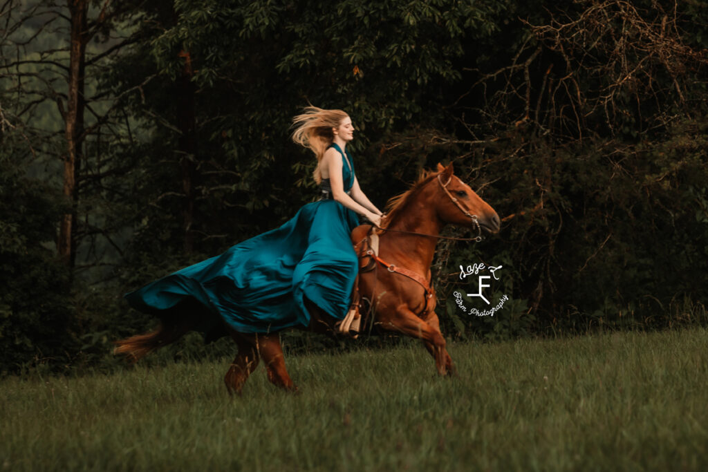 cowgirl on horse in a dress at sunset