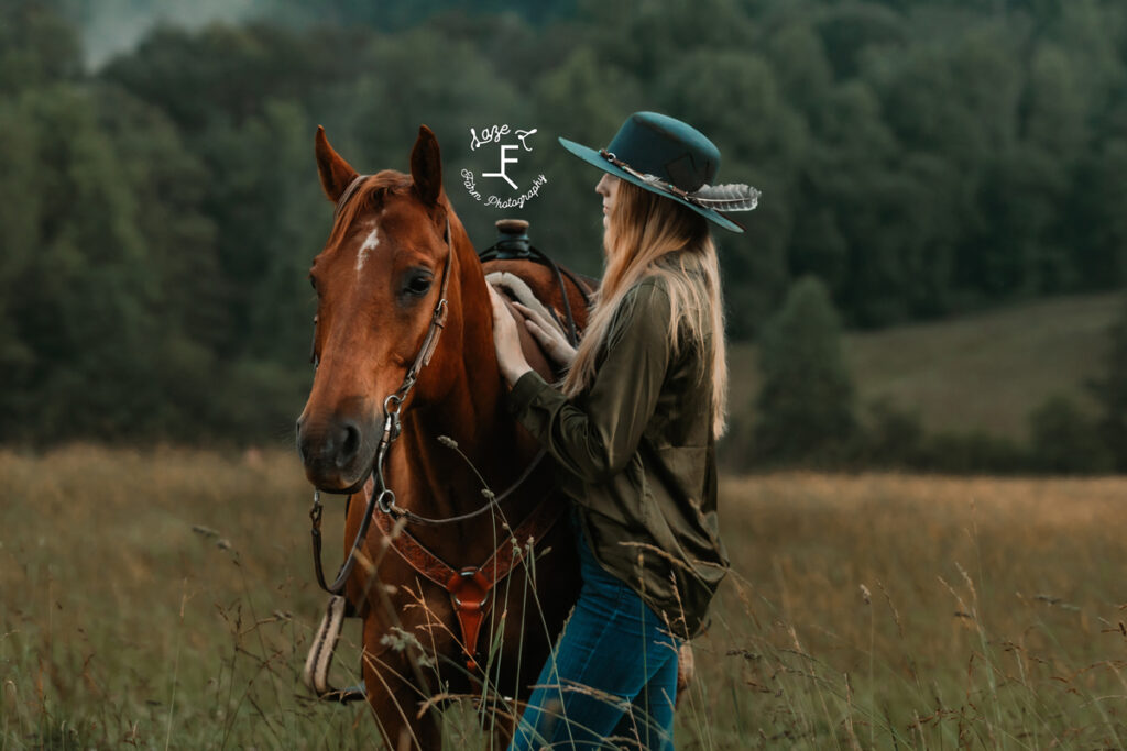 cowgirl beside horse