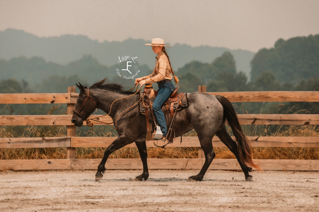 cowgirl loping horse