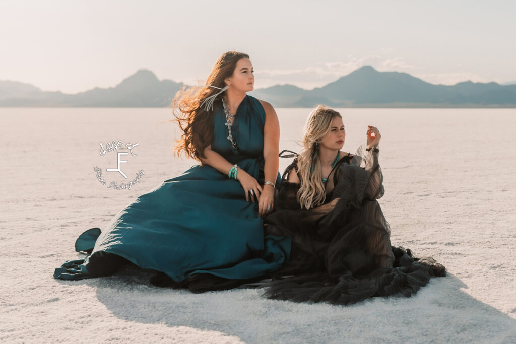 Savannah and Reid sitting on the salt flats looking left