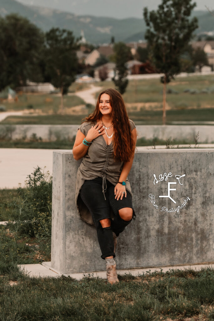 Savannah standing in front of concrete barrier