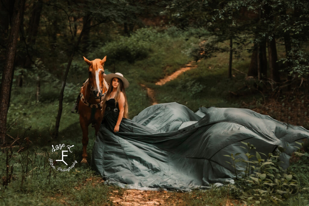 Girl in hat standing with Gus with dress flying