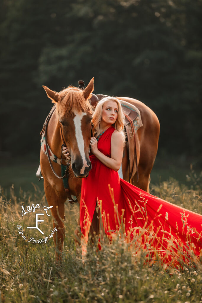 Blonde in red parachute dress standing with Gus