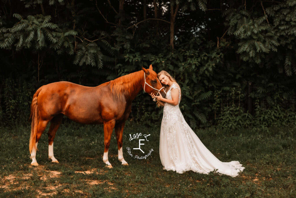 Morgan standing in front of red horse looking at camera