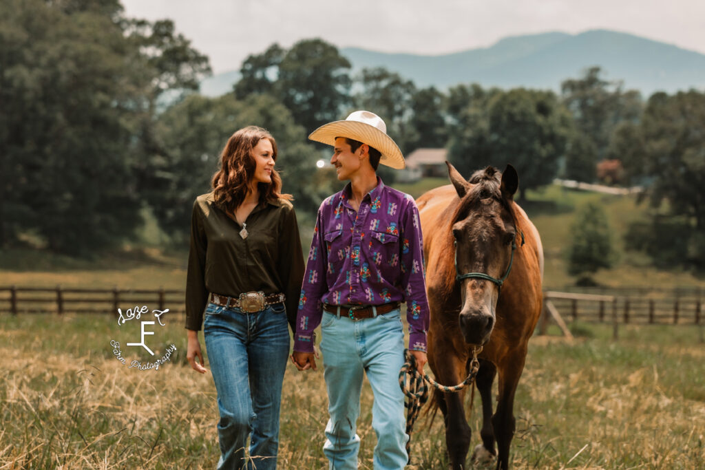 Ambry and John walking looking at each other with horse 