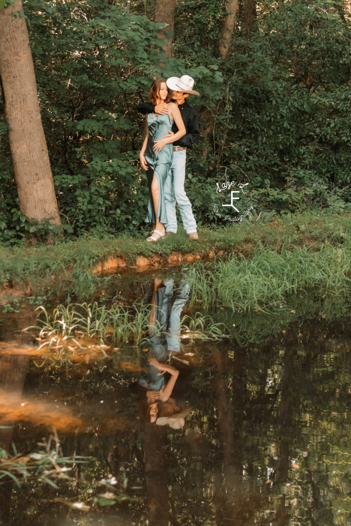 Ambry and John standing at a creek