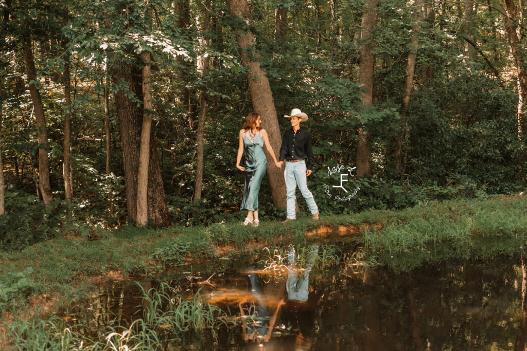 Ambry and John walking beside creek