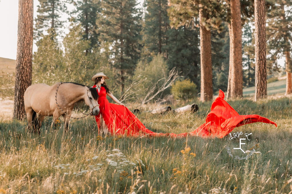 Dakota in red parachute dress looking left