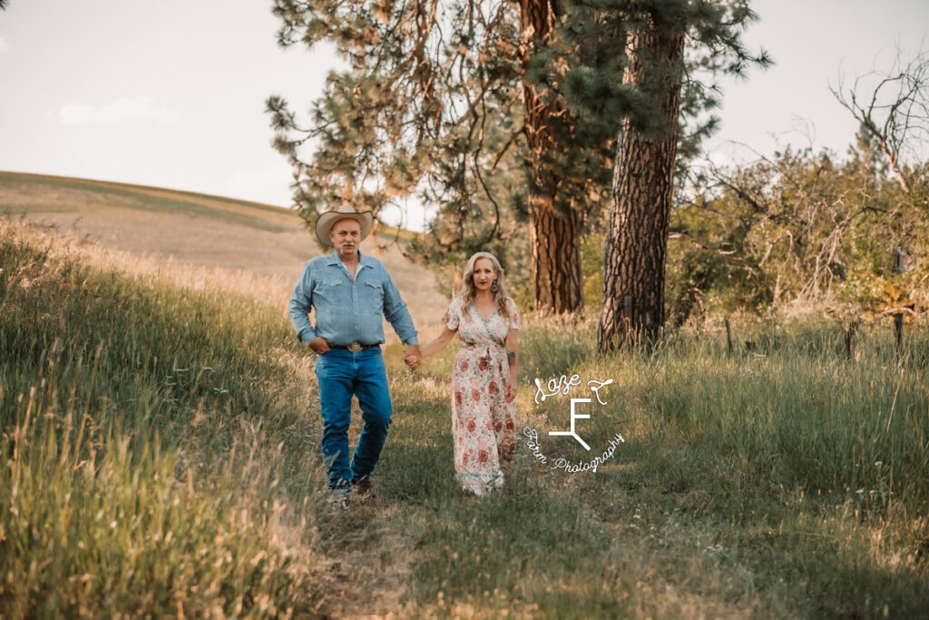 Theresa and Joe walking in field 