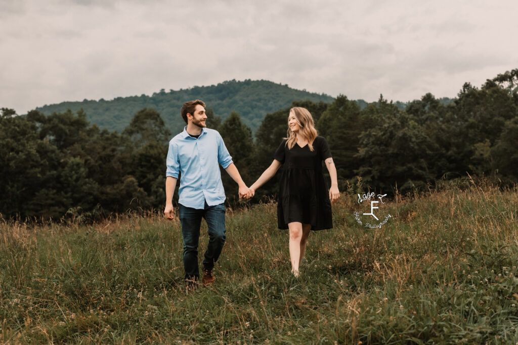 Young couple walking holding hands 