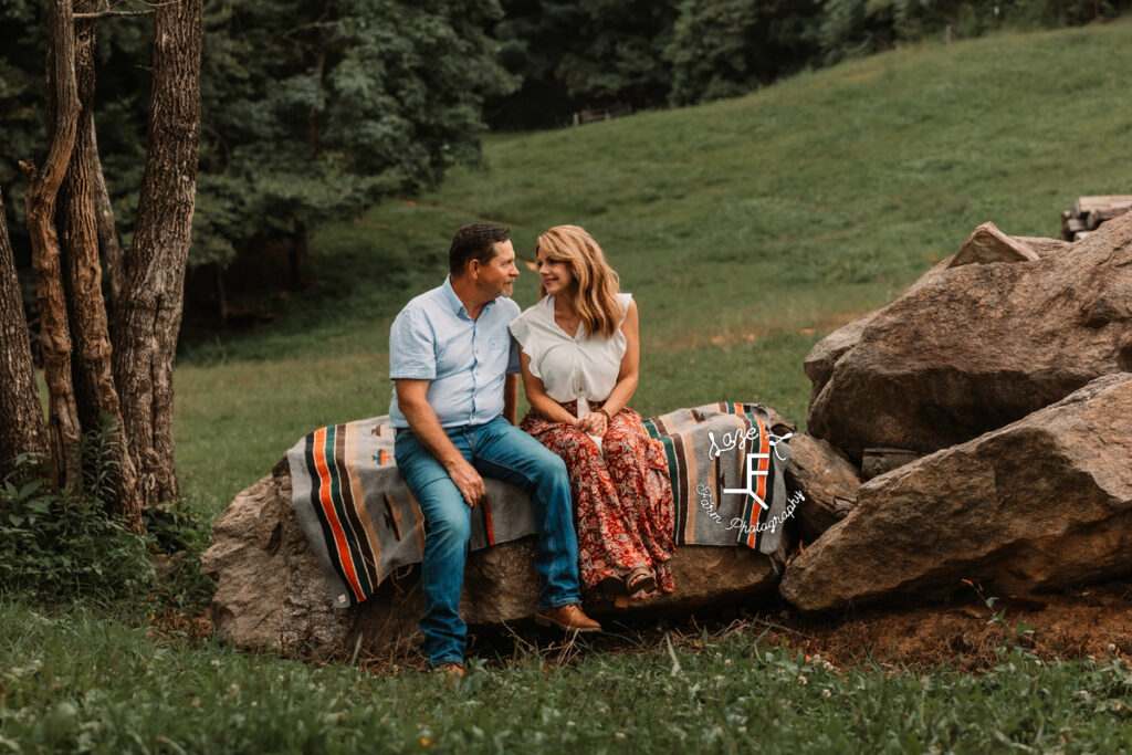 Mom and Dad sitting on rock together