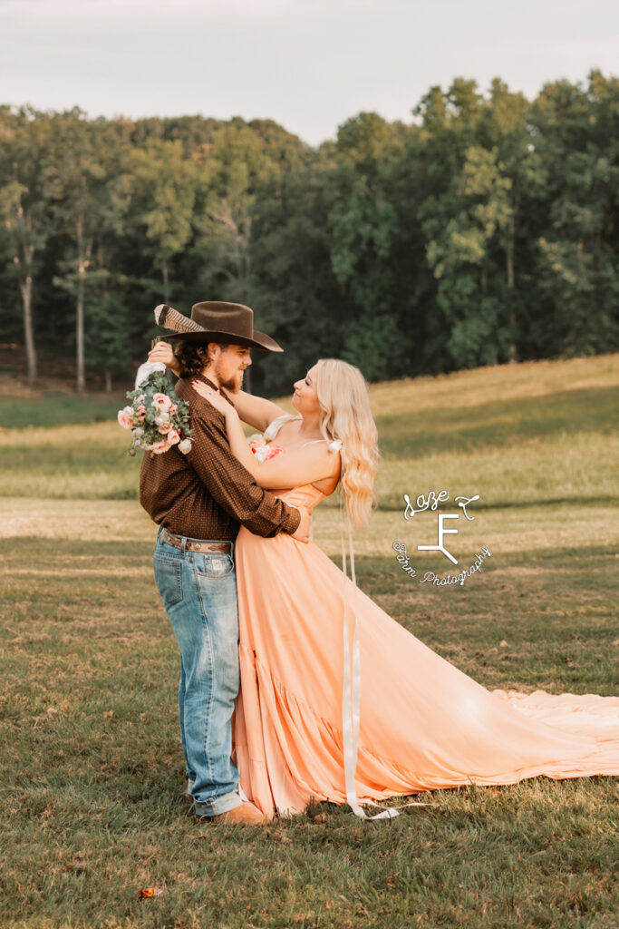 Haley in pink dress and Ethan in brown shirt and jeans