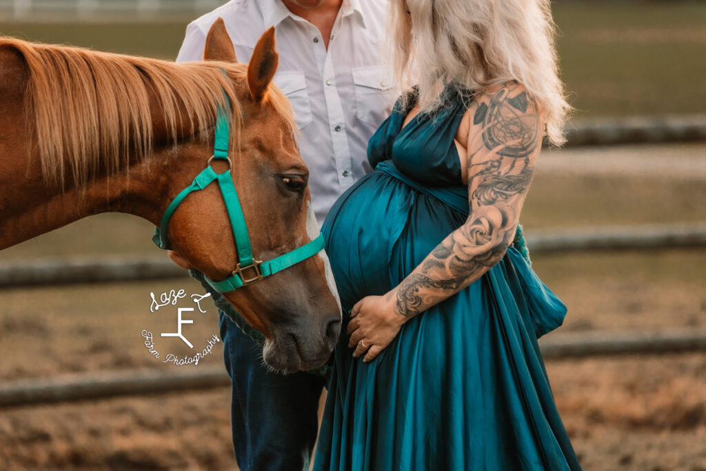 Nike and Nate with horse touching baby belly