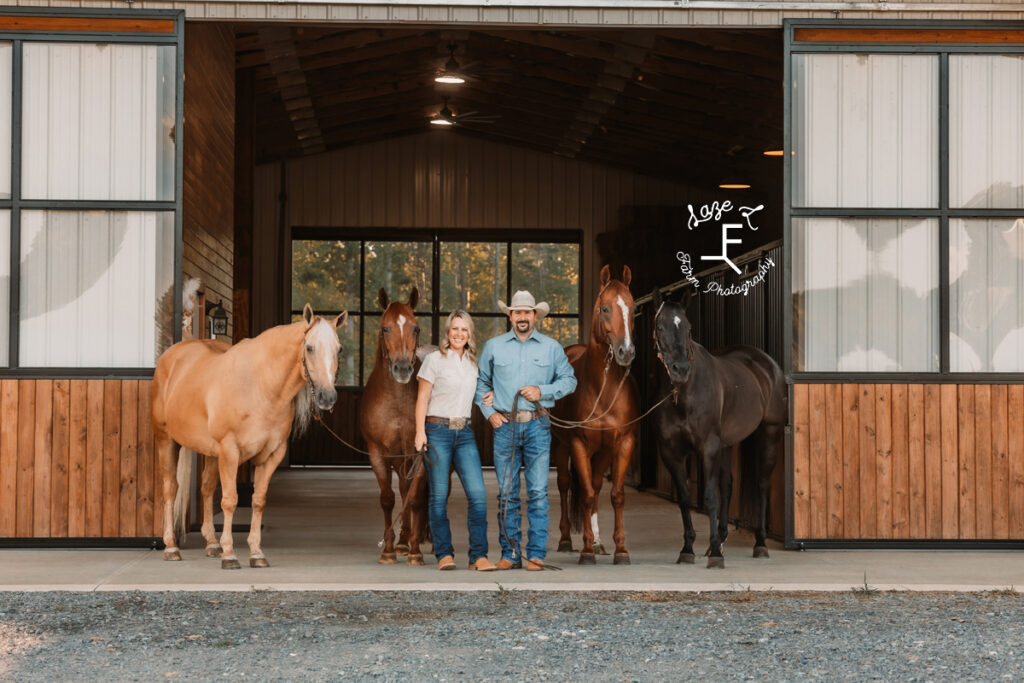 Janna and Brent and 4 horses in the barn aisle