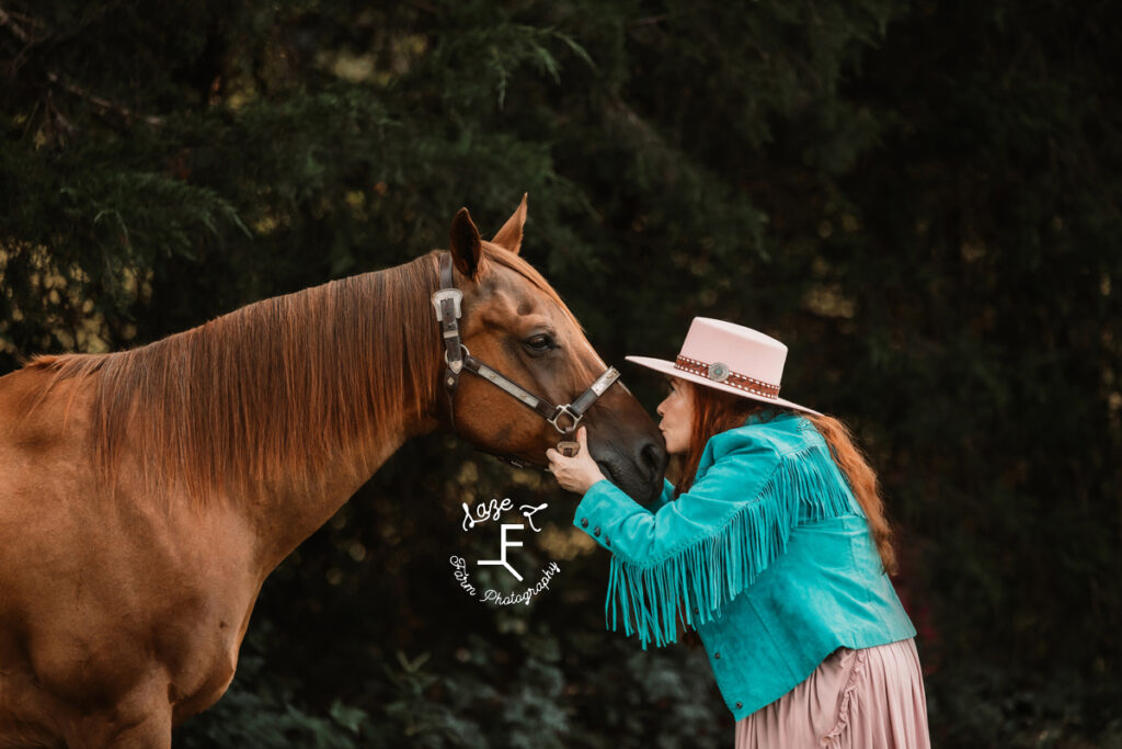 Heather kissing horses nose