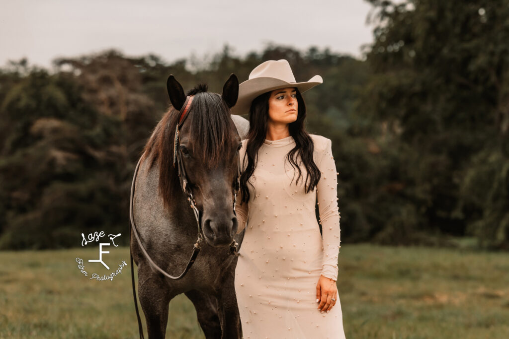 Danielle in white pearl dress with light cowboy hat with Chex