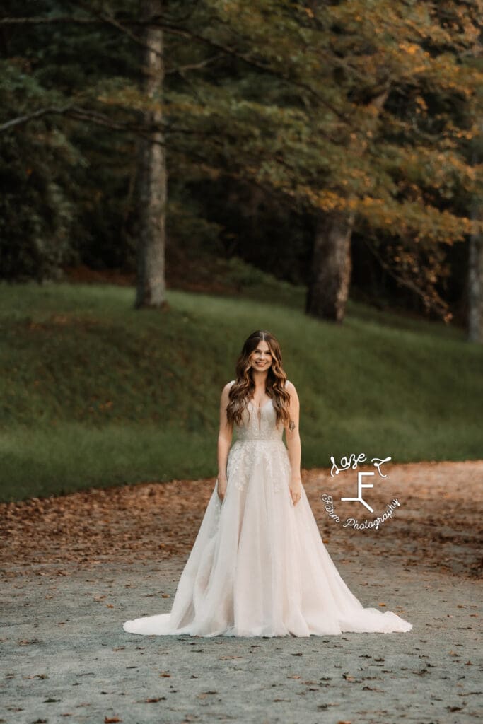 Teagan standing on gravel rode 