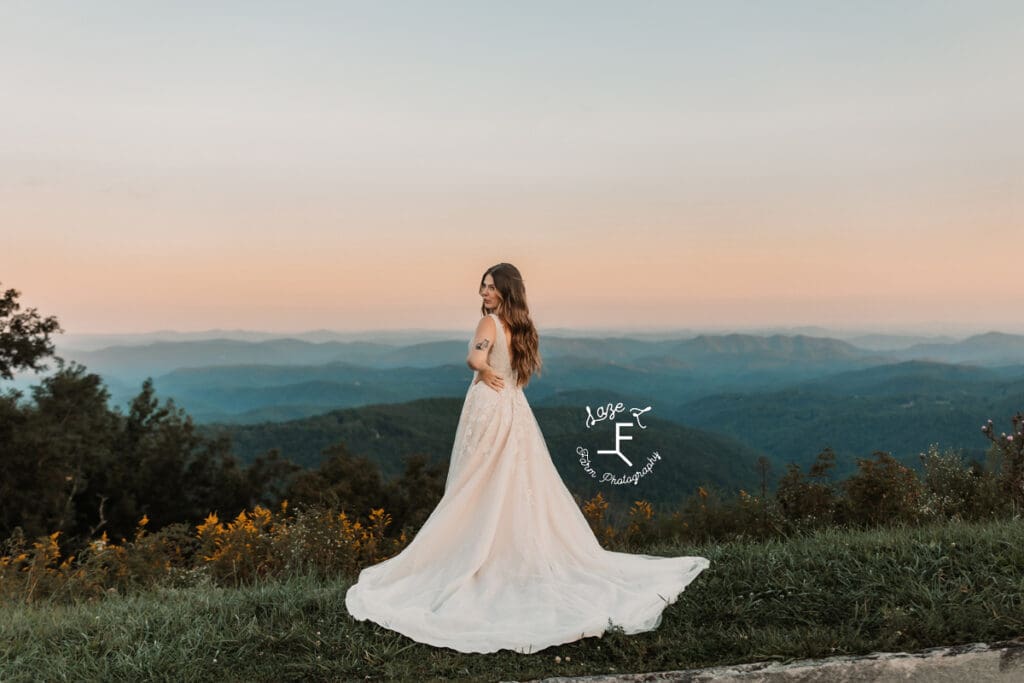 Teagan facing the Blue Ridge Parkway looking back over shoulder