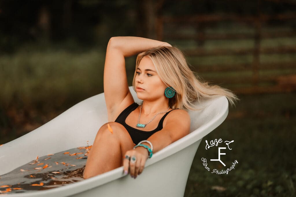 Reid in bath tub with flower petals