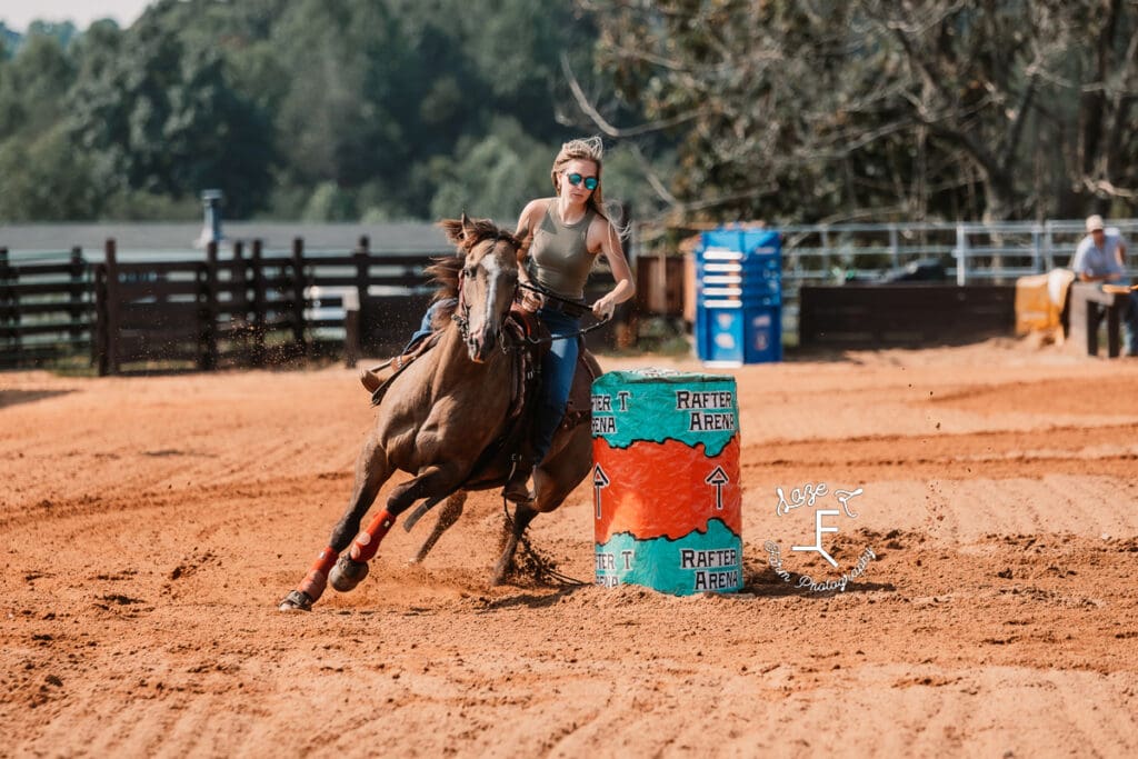 girl coming around barrel