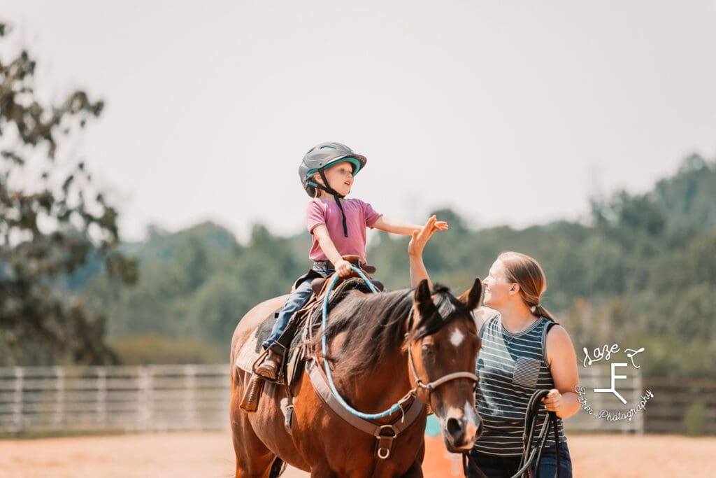 mom and little girl giving high five