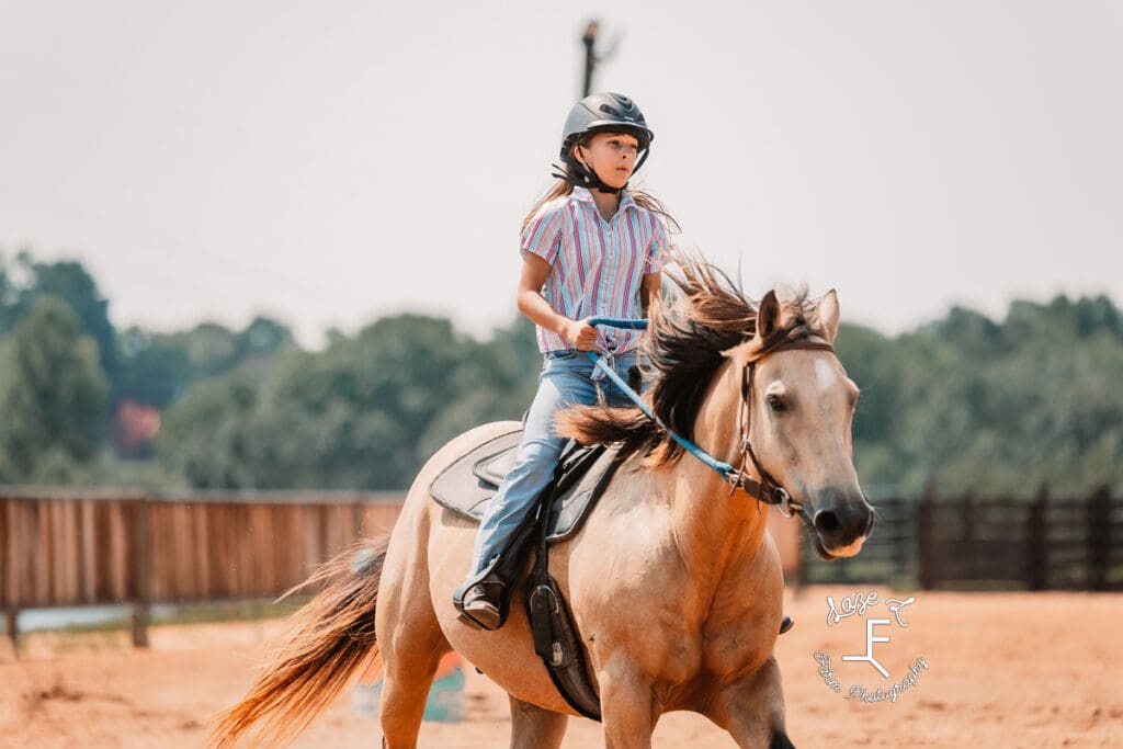 girl on buckskin horse